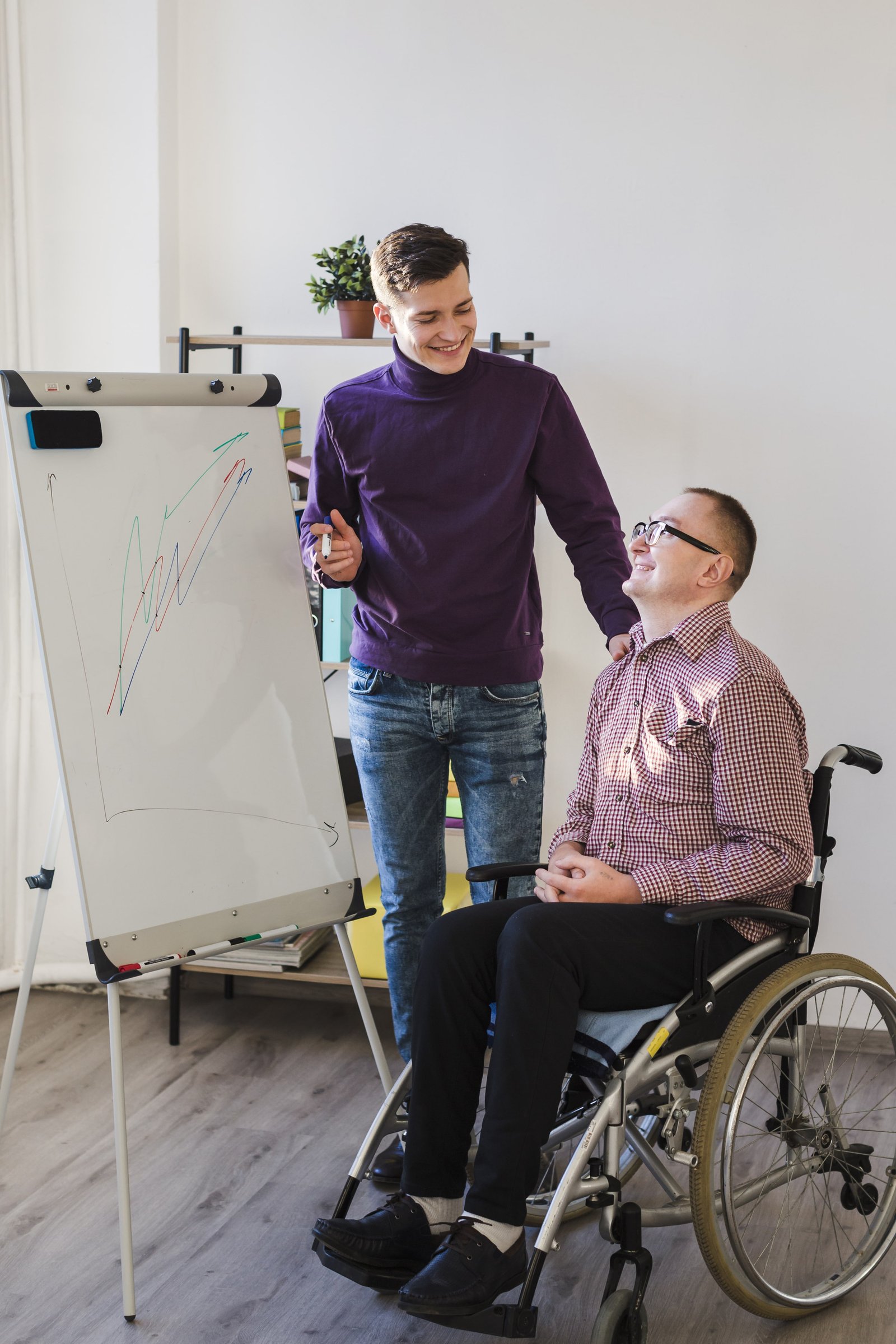 disabled-man-working-office-min